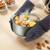 A set of four heat resistant silicone oven gloves and pot pads shown with food in a metal pot.