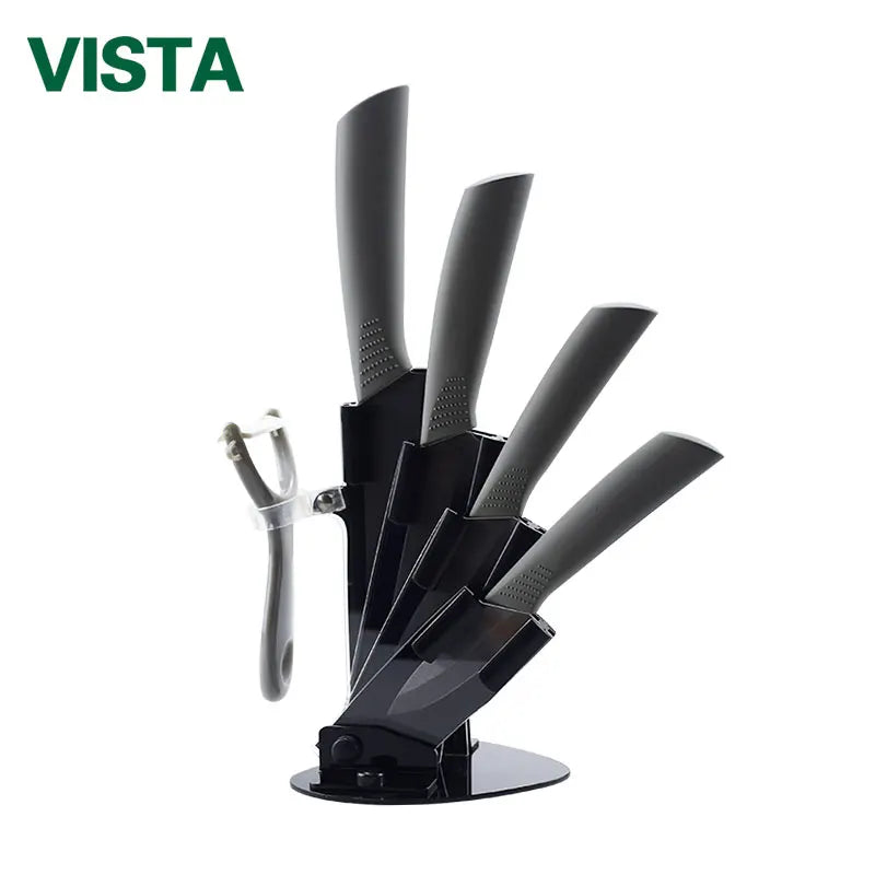 A black ceramic multi-use kitchen knife set with multiple blades displayed on a stand.