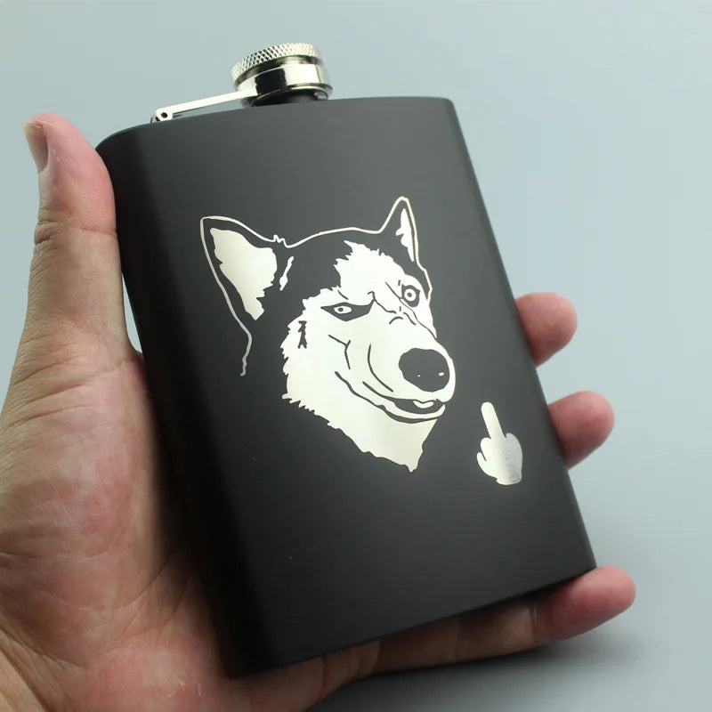 A black laser engraved stainless steel hip flask with a white silhouette of a dog's head and a pointing finger.