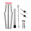 A set of professional stainless steel cocktail shakers including a shaker, stirring spoon, and muddler.