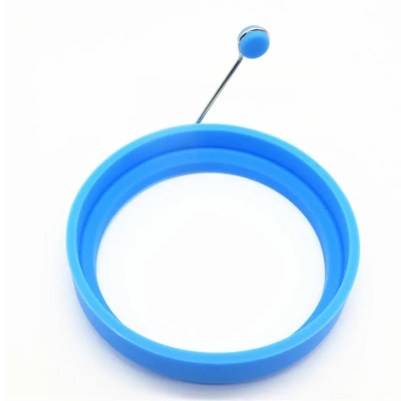 Blue silicone ring with a metal pin, used for making egg pancakes.