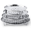 A stack of multi-size stainless steel food steamer racks with various perforated trays.
