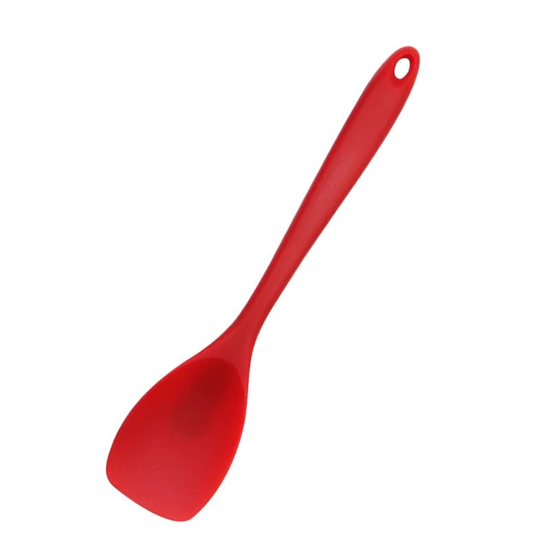 A bright red food grade silicone cooking spatula with a rounded handle.