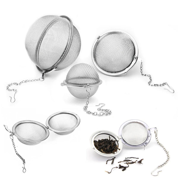 Stainless steel tea infuser spheres including a mesh sphere, a small bowl, and an open lid.
