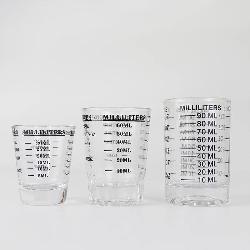 Three clear glass measuring cups with volume markings for liquid measurement.