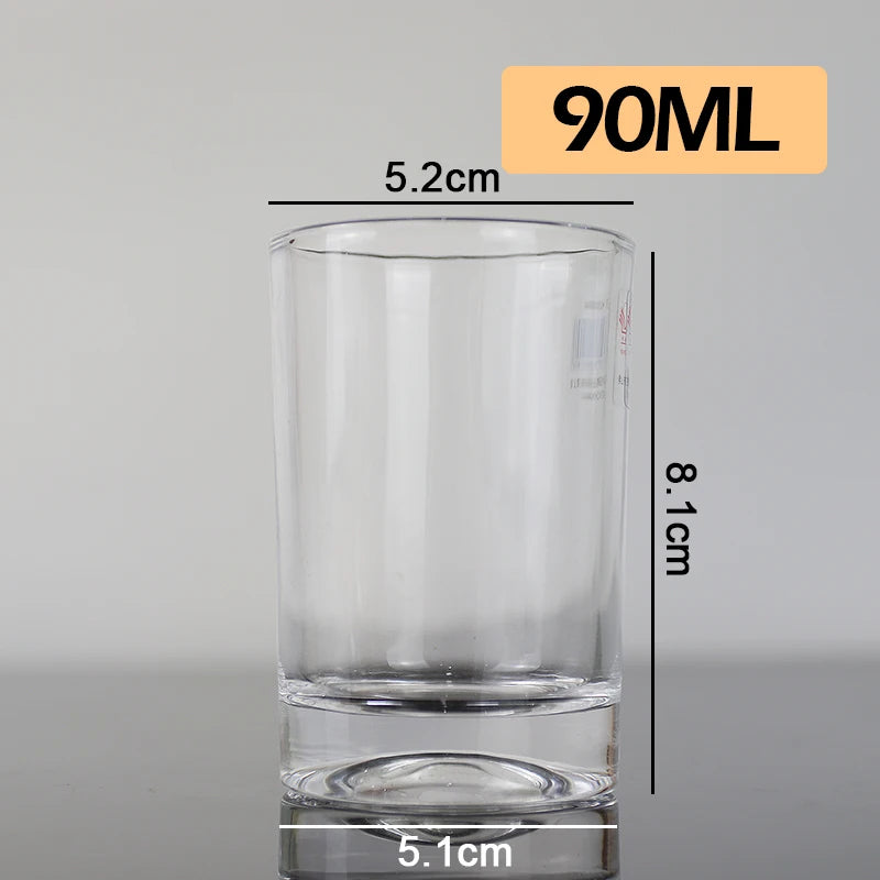 A clear glass measuring cup with volume markings, showing dimensions of 90ML and 5.2cm height.