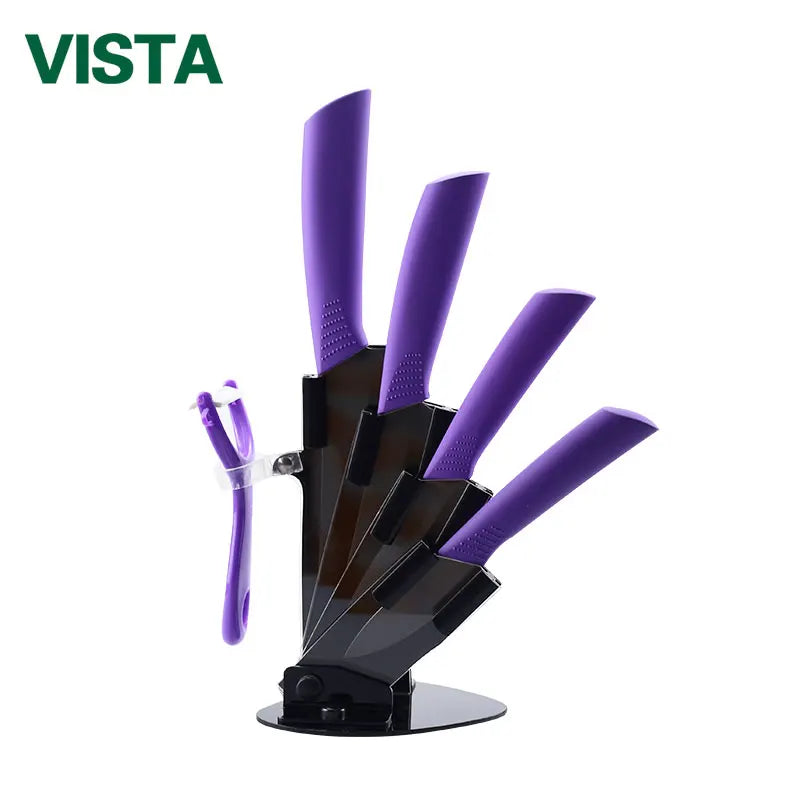 A set of purple ceramic multi-use kitchen knives displayed on a black holder.