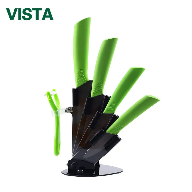 A set of green ceramic multi-use kitchen knives displayed in a black holder.