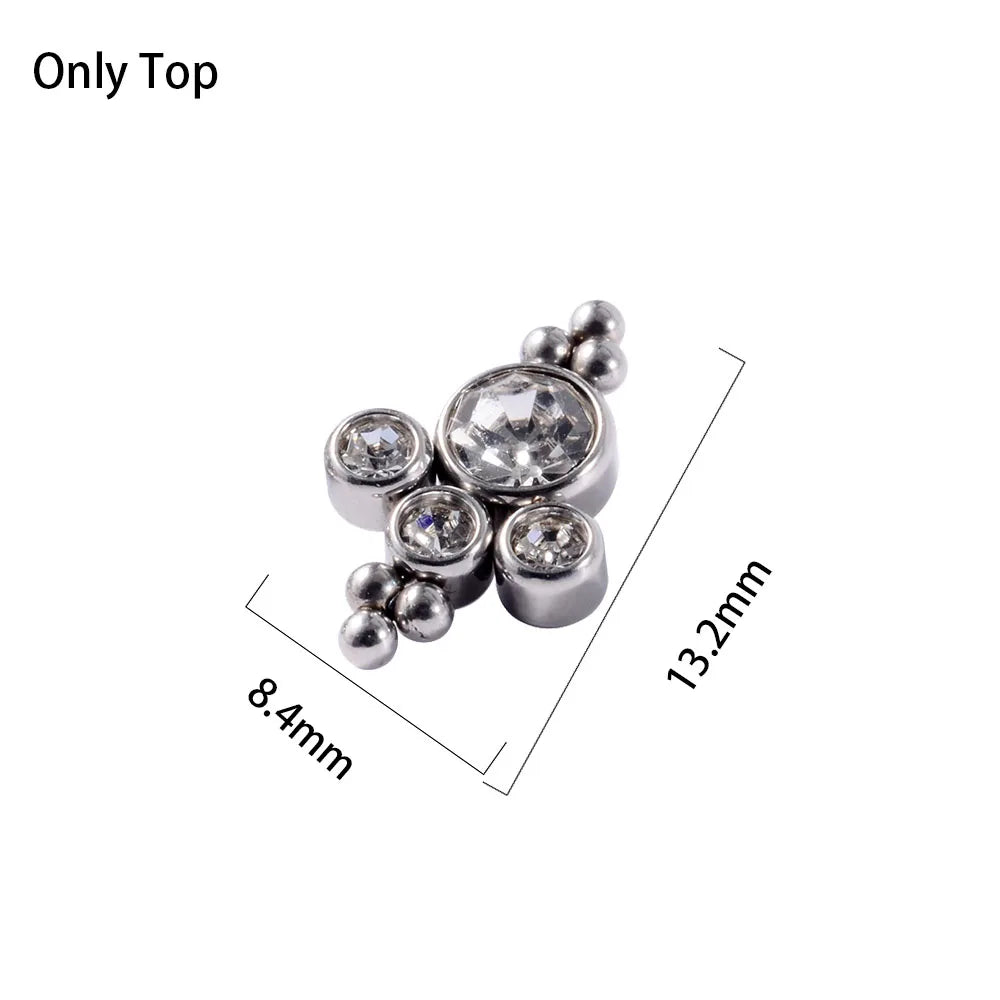 A close-up view of a surgical steel dermal anchor body jewelry piece with multiple small spheres and a central clear stone.