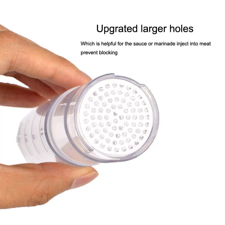A hand is holding a clear plastic meat tenderizer with upgraded larger holes for injecting sauce or marinade into meat.