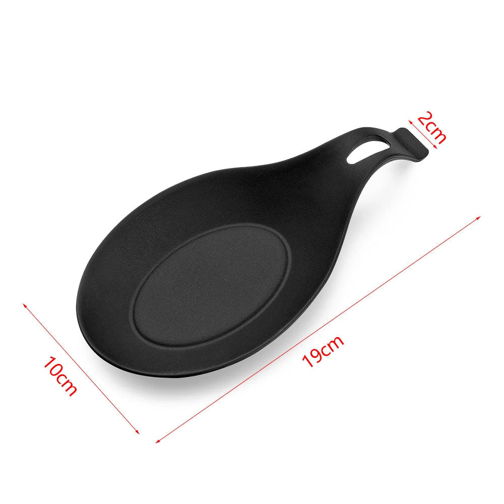 Black silicone utensil holder with a handle and oval bowl, shown from above.