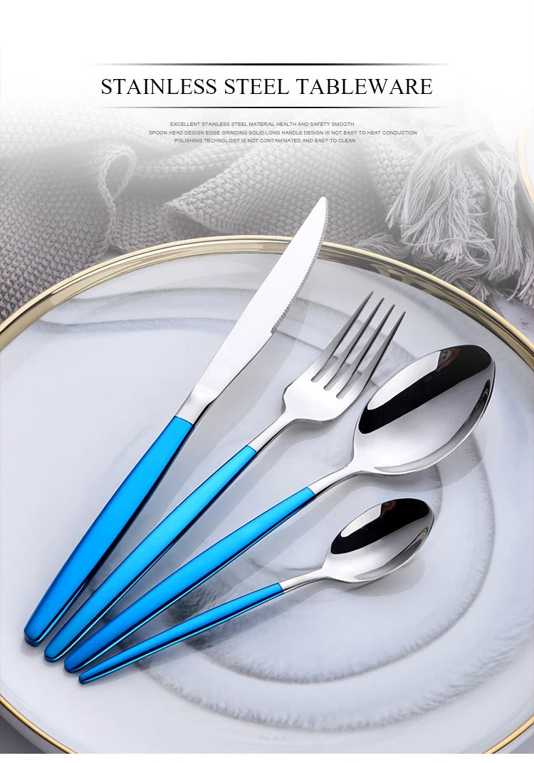 A set of elegant stainless steel flatware including a knife, fork, and spoon displayed on a white plate.