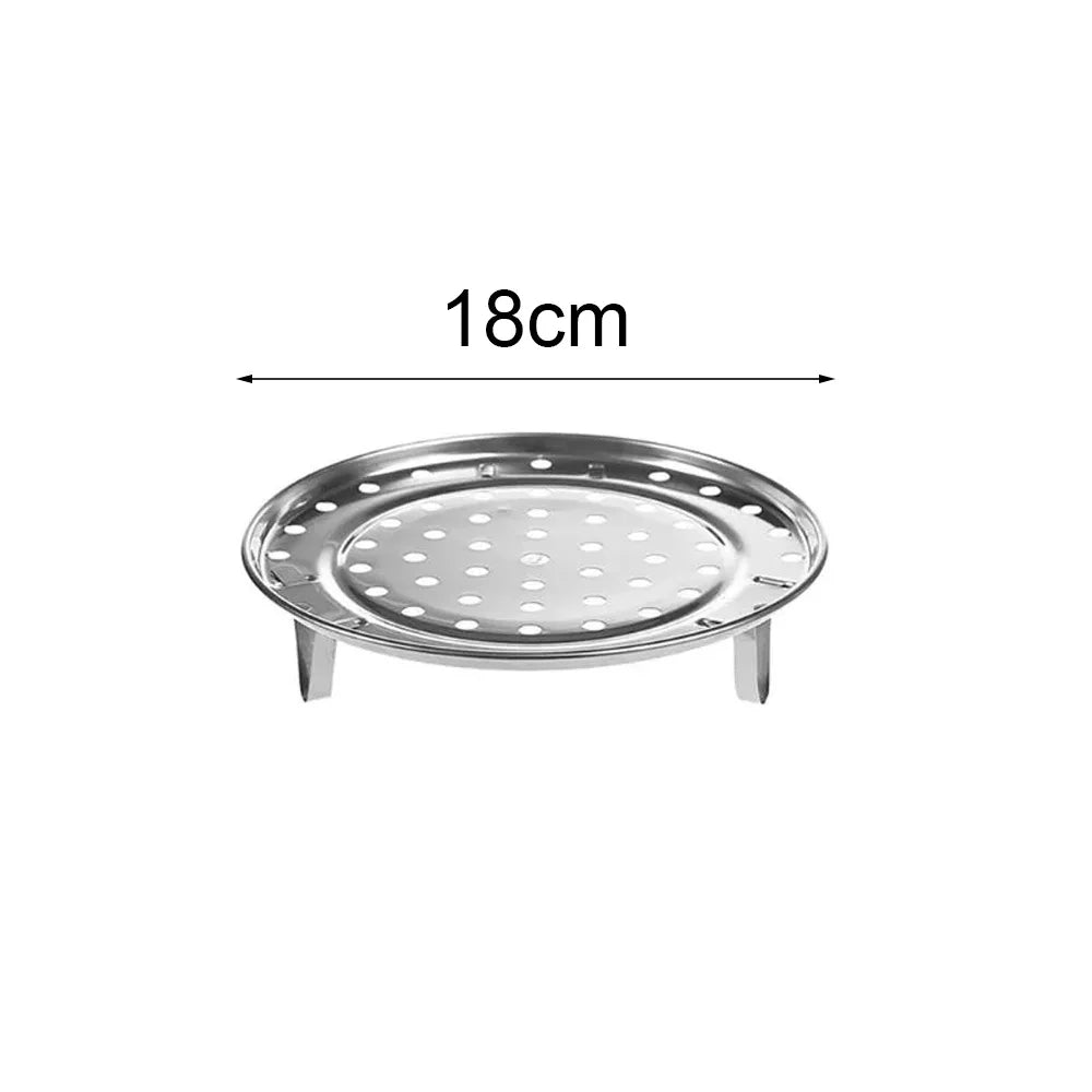 A round, stainless steel food steamer rack with a 18cm diameter.