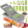 A multi-functional vegetable chopper and fruit slicer set with various green and gray tools and a transparent slicing tray.
