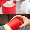 A hand uses a knife to scoop silicone grease from a red container, demonstrating the product for kitchen oils.