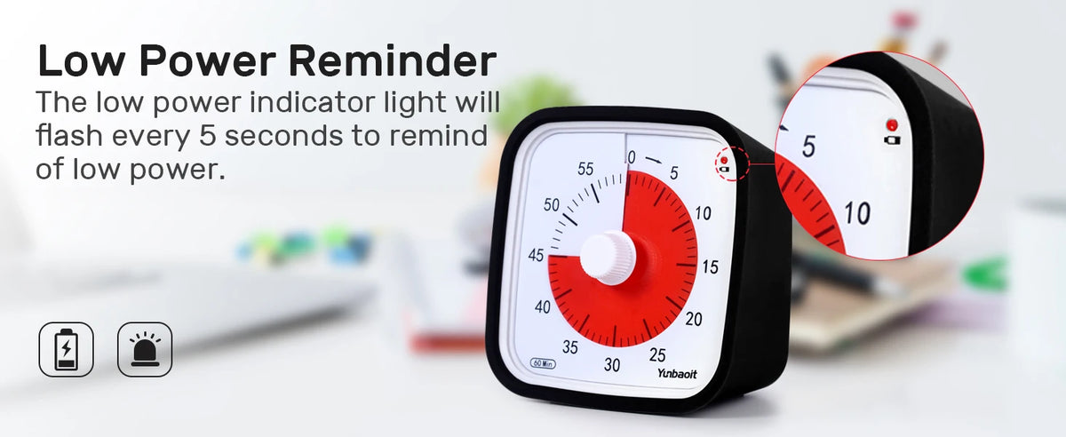 A black visual countdown timer with a red indicator showing low power, set against a blurred background.