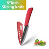 A red ceramic slicing knife and a black blade are shown next to fresh vegetables.