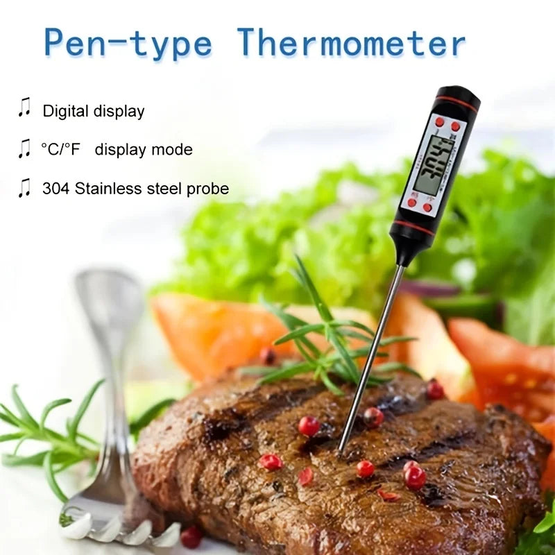 A digital pen-type thermometer with a stainless steel probe is shown next to a grilled steak and fresh vegetables.