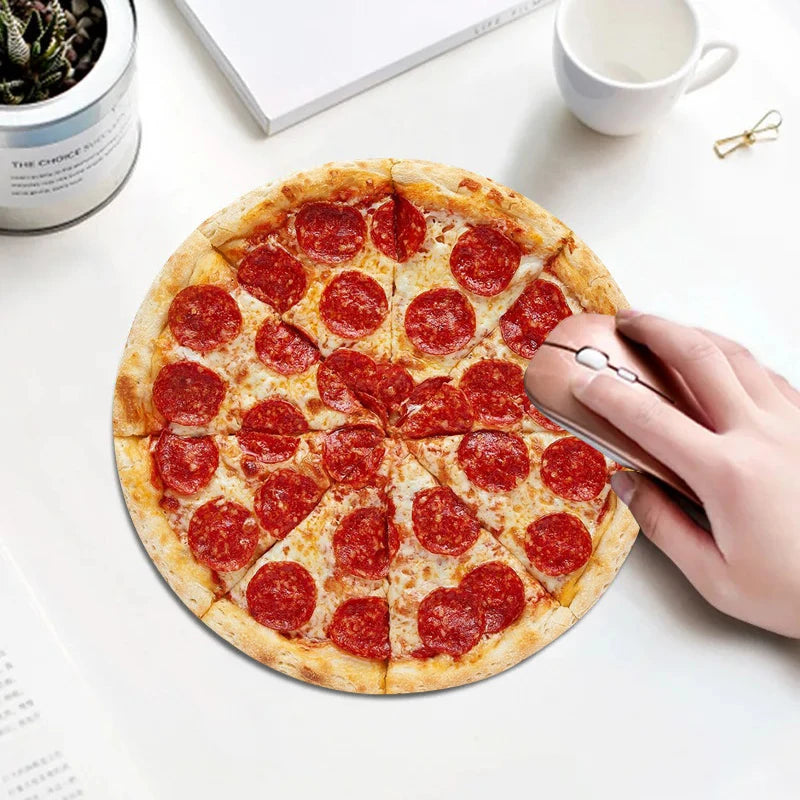 A hand is lifting a round pizza with pepperoni slices from a pizza on a white surface.