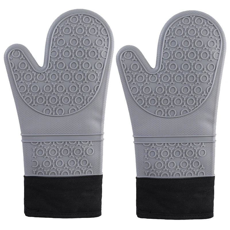 A pair of gray heat resistant silicone oven mitts with a textured grip and black wrist straps.