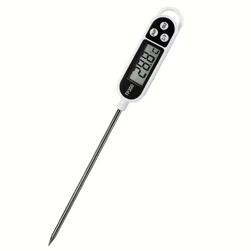 A white digital kitchen food thermometer with an instant read probe displaying a temperature reading.