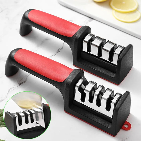 A black and red handheld knife sharpener with tungsten steel blades is shown on a white marble surface.