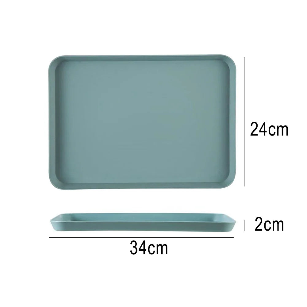 A rectangular serving tray in a muted teal color shown with its dimensions: 24cm by 34cm, and a 2cm depth.