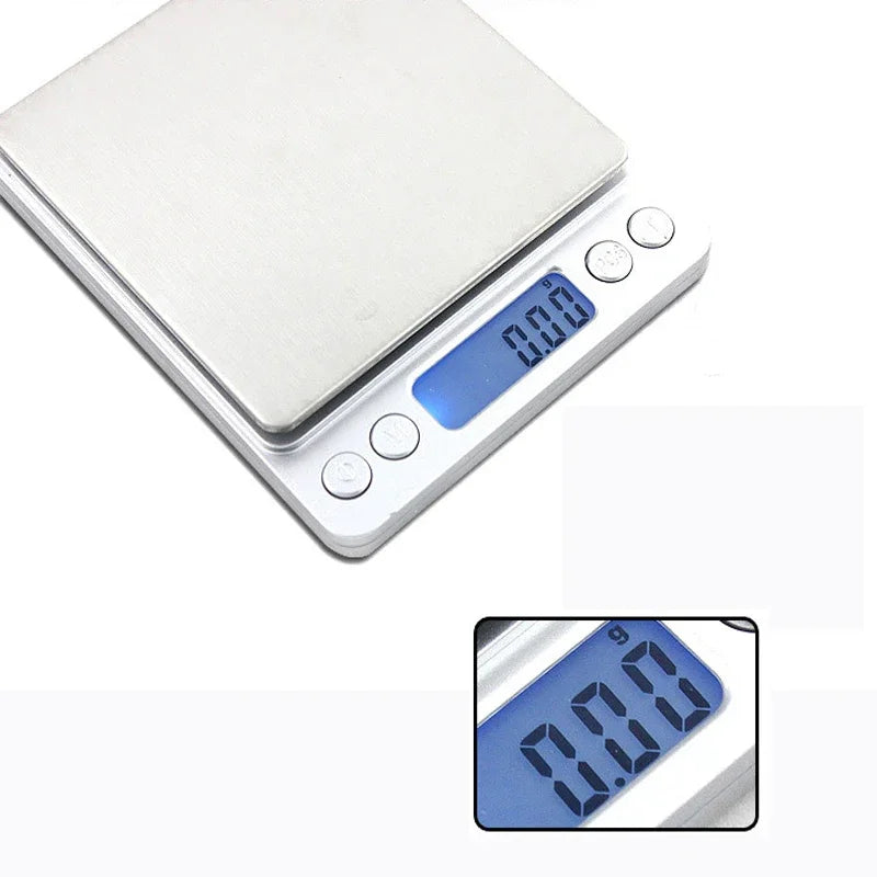 A white digital scale with a blue display showing 0.00 grams.