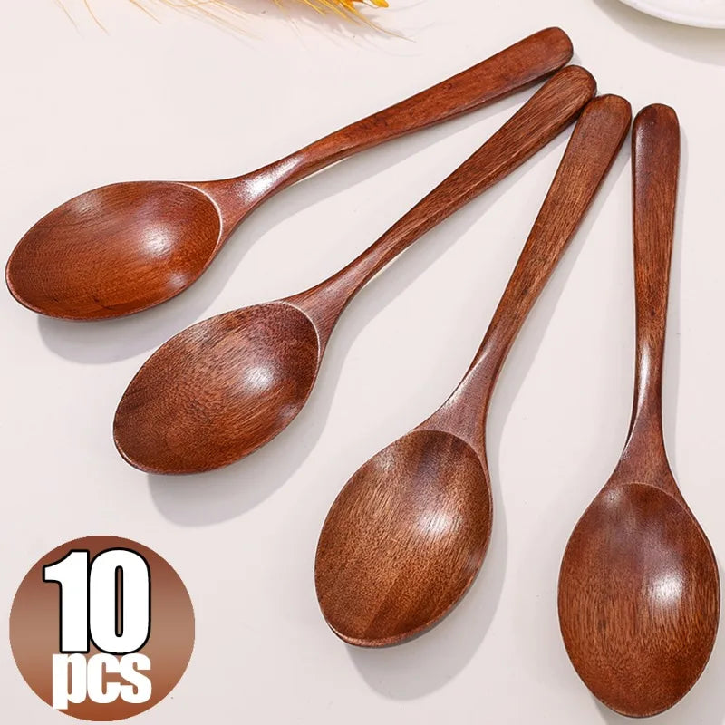 A set of ten natural brown wooden serving spoons arranged on a light background.