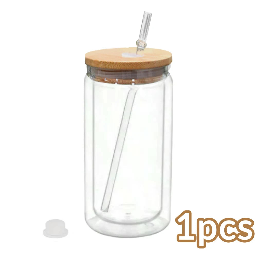 A clear glass tumbler with a cork lid and a metal straw, used as a DIY snowglobe.