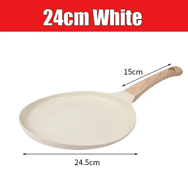 A white ceramic non-stick griddle pan with a wooden handle shown from above.