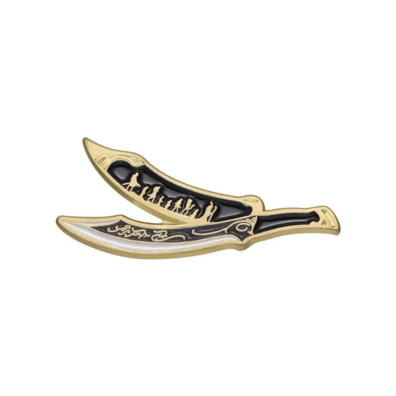 A gold-colored enamel pin featuring a stylized sword design with a silhouette of figures on the blade.