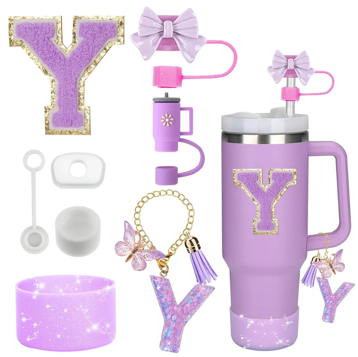 A set of purple silicone straw toppers, a bow, and a glittery letter Y for a tumbler accessory kit.