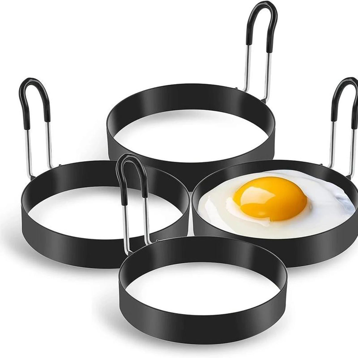 A set of black stainless steel egg rings with handles for breakfast cooking.