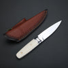 A brown leather sheath holds a silver fixed blade knife with a light handle.