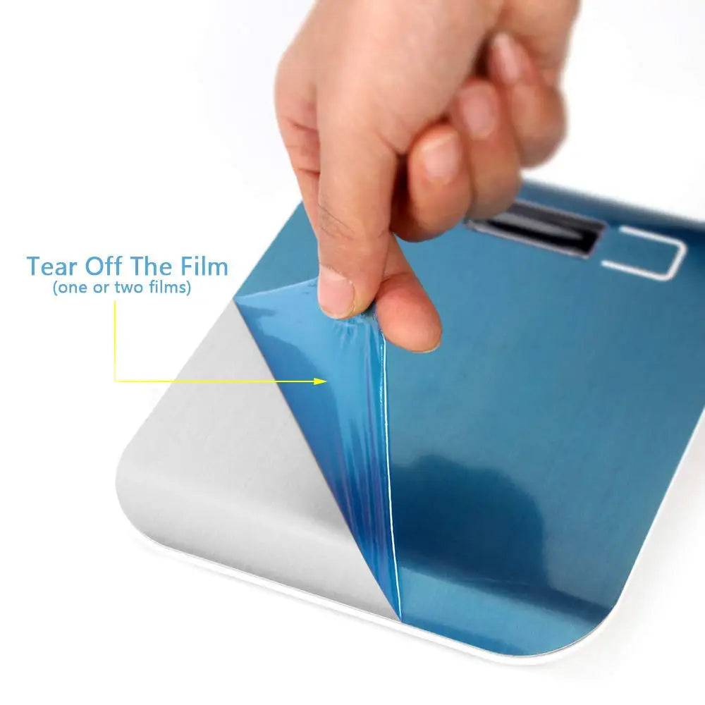 A hand is tearing off a film from a blue precision digital kitchen scale.