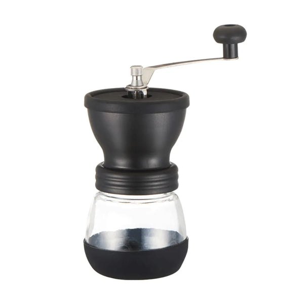 A manual coffee grinder with a glass burr and a black storage container.