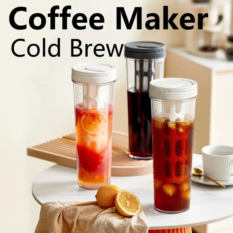 A glass jar filled with iced coffee brew sits next to a dark glass container on a white table.
