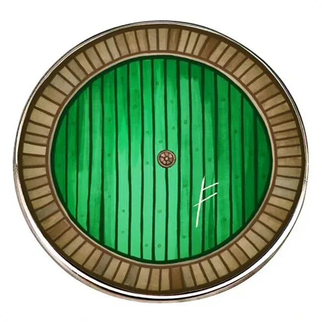 A circular enamel pin featuring a green, vertically-striped background with a central circular detail.