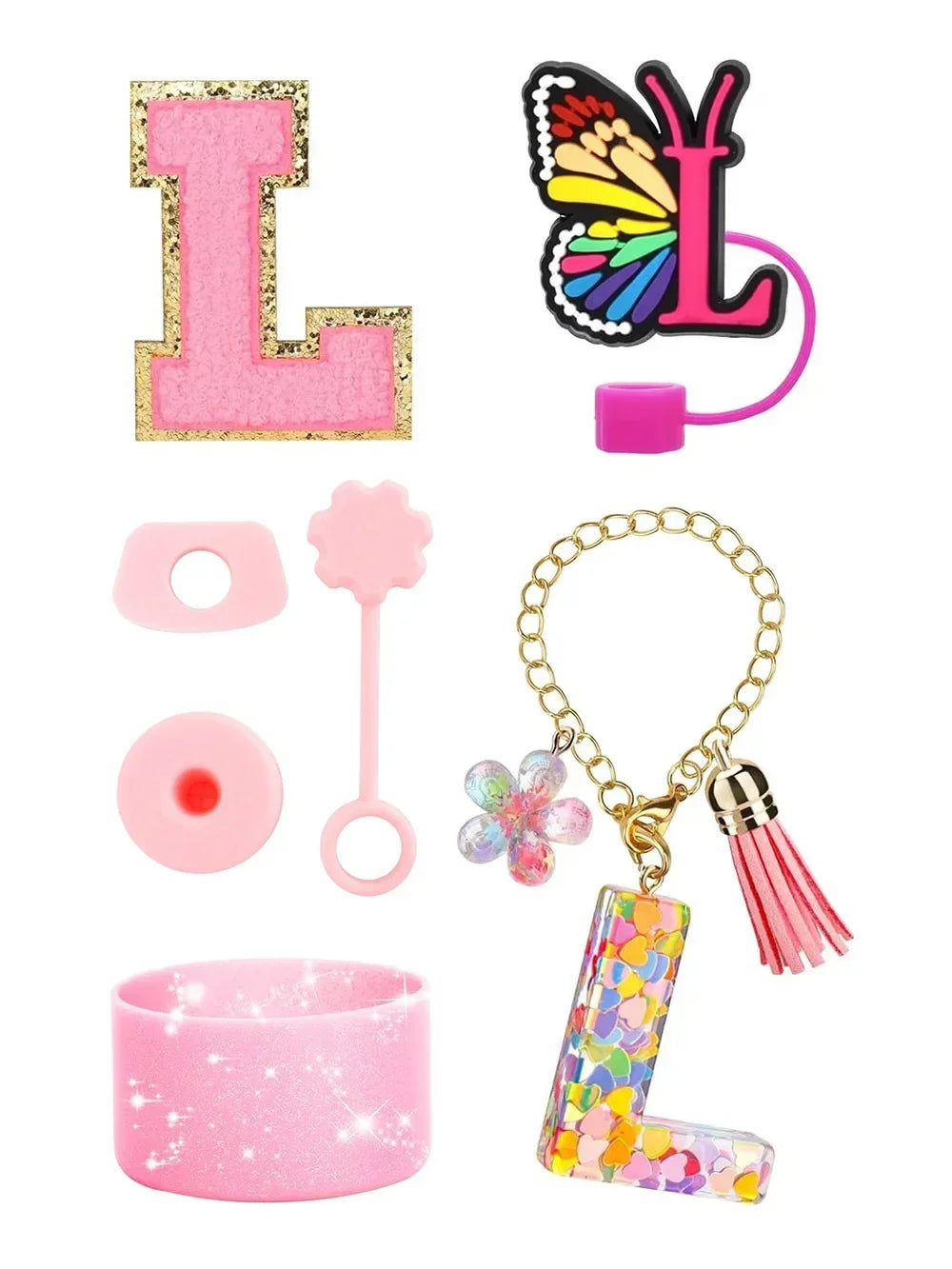 A set of silicone straw covers for tumblers including a pink letter L, a pink dot, and a gold chain with a colorful letter L.