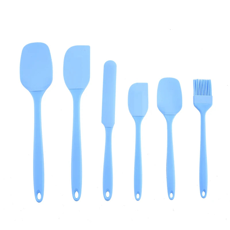 A set of six light blue silicone kitchen tools including spatulas and a brush