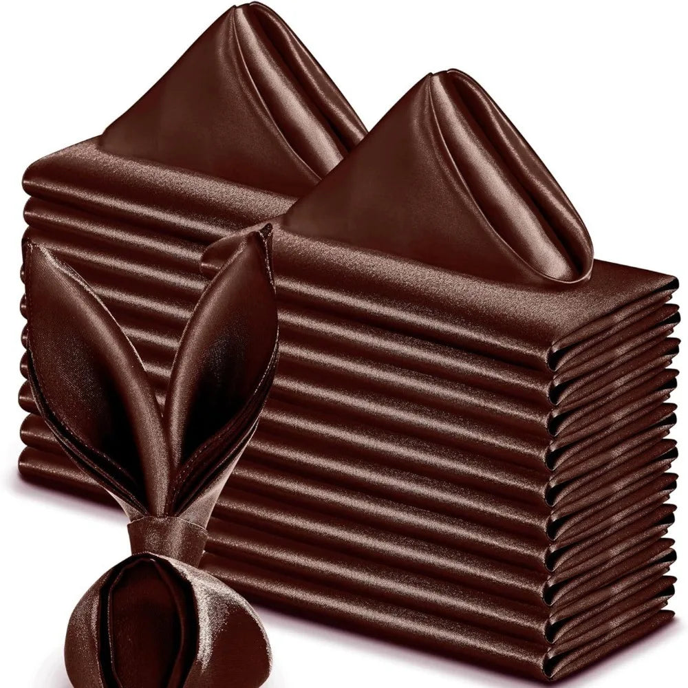 A stack of ten dark brown satin dinner napkins folded and tied