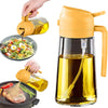 A glass oil sprayer and pour bottle with a yellow pump dispenser pouring olive oil.