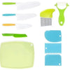 A set of plastic fruit and cake cutting tools in various colors including green, yellow, and blue.