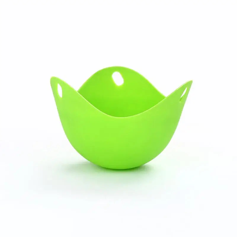 A bright lime green silicone egg poacher mold used for cooking in a microwave or air fryer.