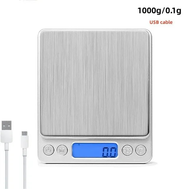 A silver digital kitchen scale with a blue display and USB cable connector.