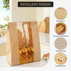 A set of kraft bakery bags with a transparent window and sealing stickers displayed on a counter.