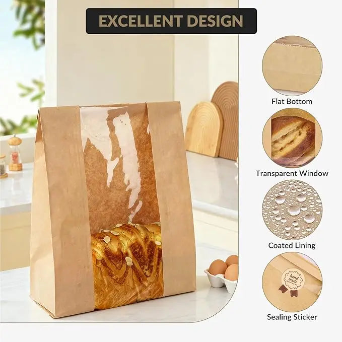 A set of kraft bakery bags with a transparent window and sealing stickers displayed on a counter.