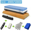 A set of multi-grits knife sharpening stones including a blue and black stone, a white block, and a blue cloth.