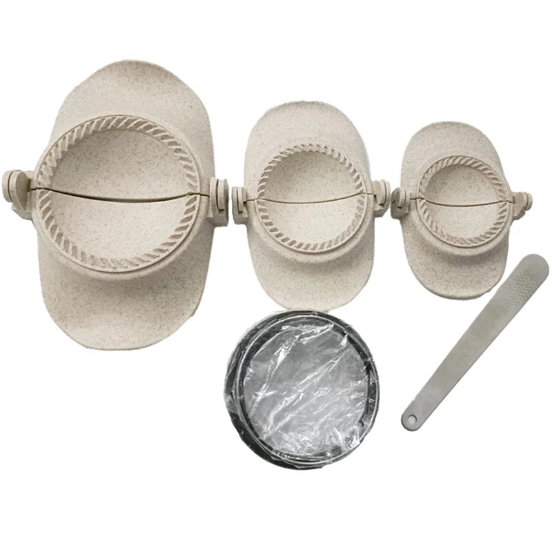 A set of three light beige dumpling and empanada press molds with accompanying metal tools.